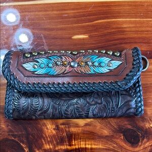 Handcrafted Leather Clutch with Feather Design